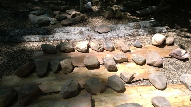 This picture shows the part of the process where the Monacan Indians placed the bark on the ground and flattened it with the rocks.  If I recall, it took a few weeks to flatten the bark.